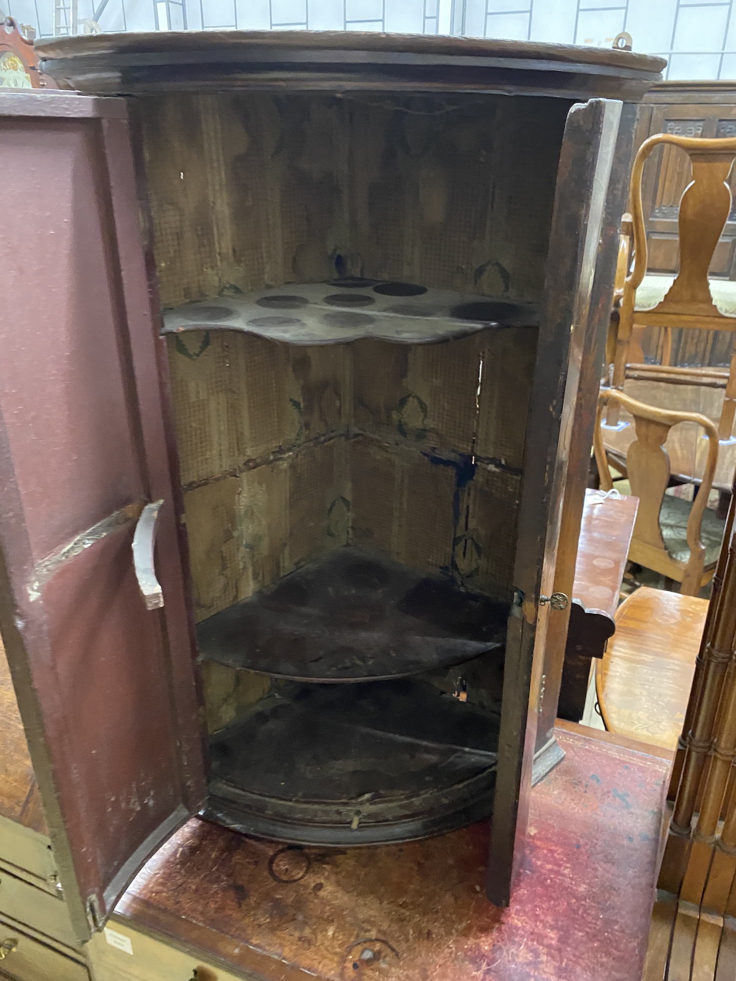 An 18th century chinoiserie lacquer bow front hanging corner cupboard, width 60cm, depth 40cm, height 92cm